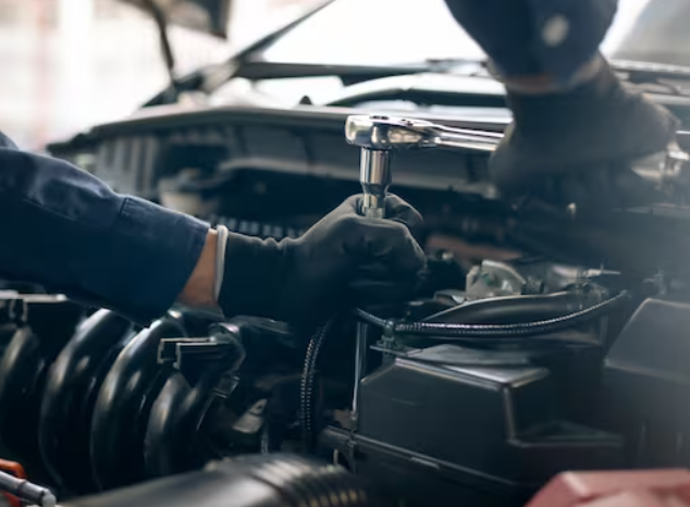 Engine service being performed in an auto shop.