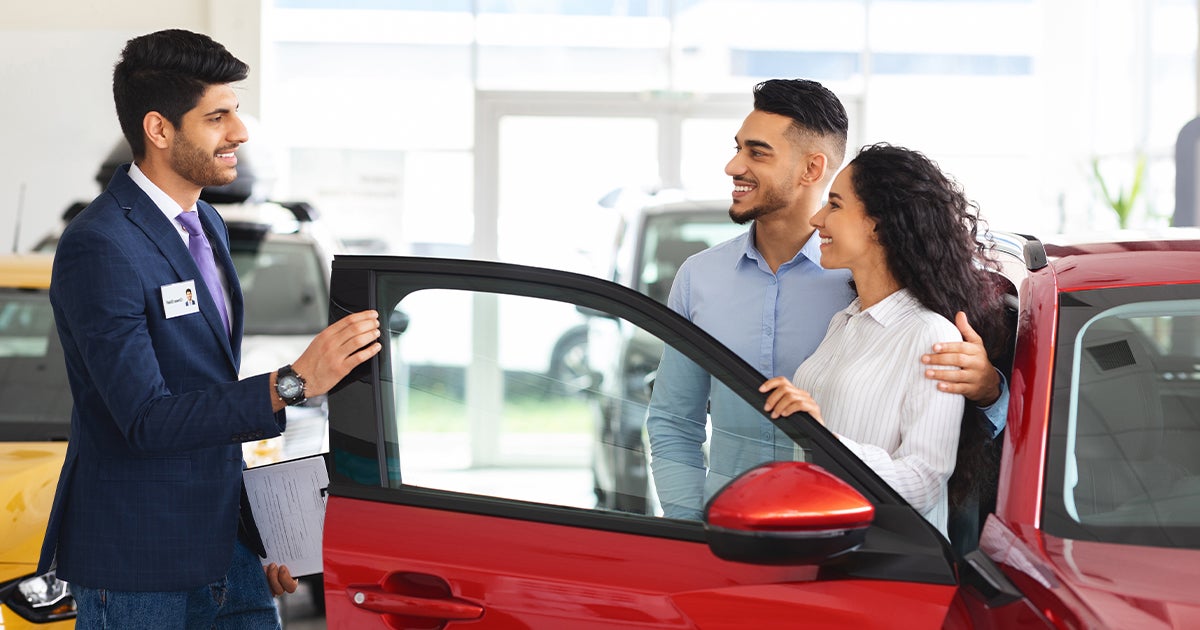 Sales member talking with customers 